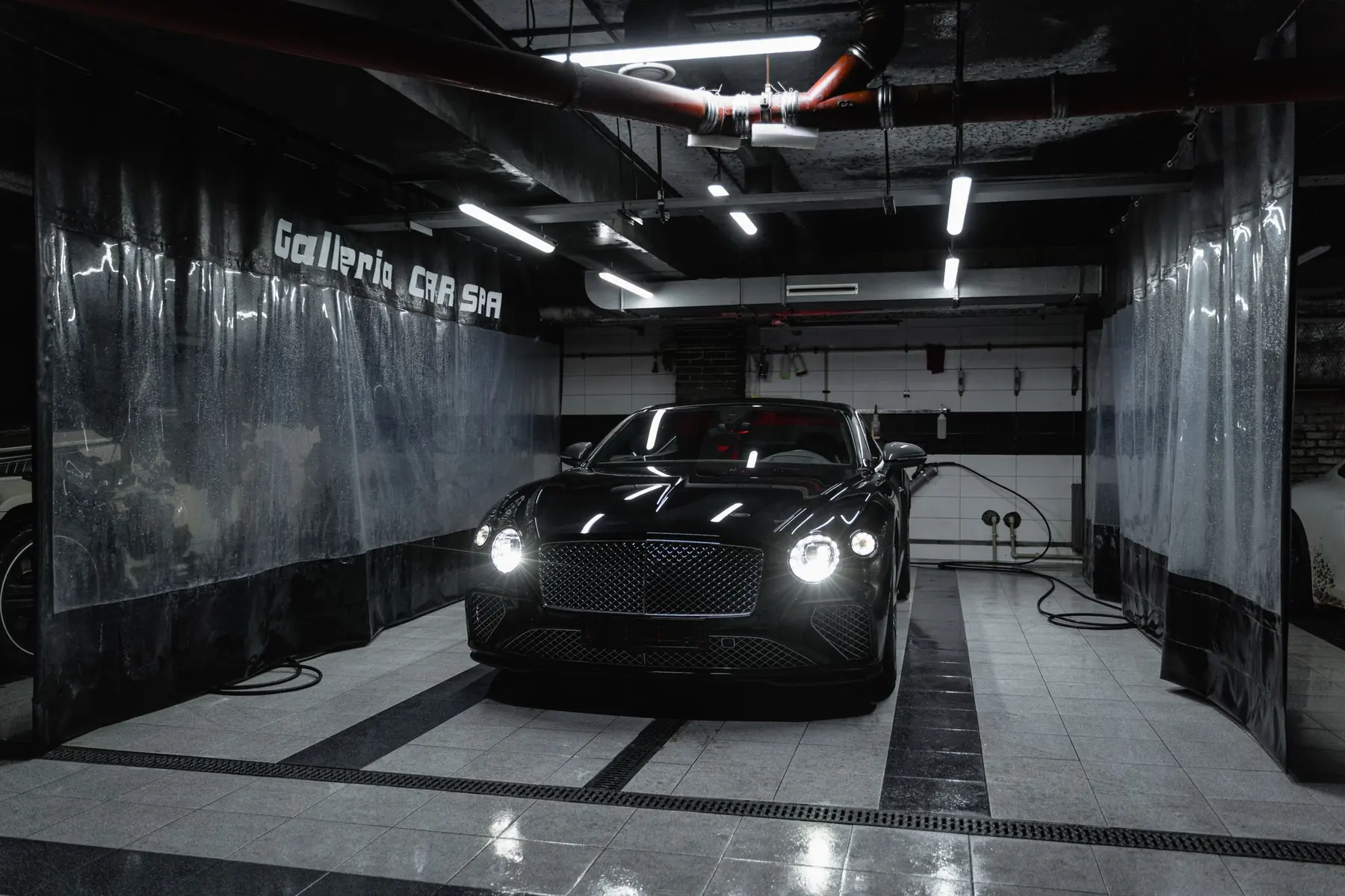 Detailing bay under studio lights