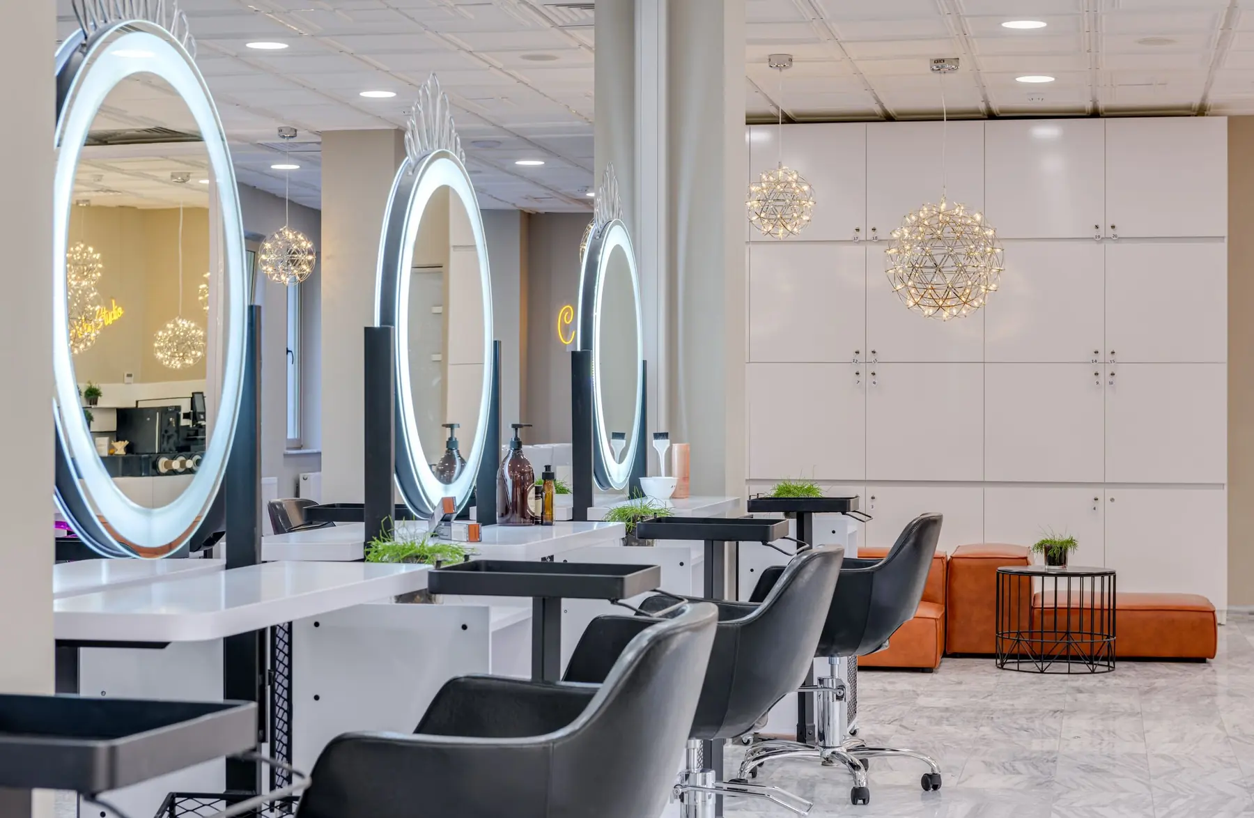 Salon with round illuminated mirrors