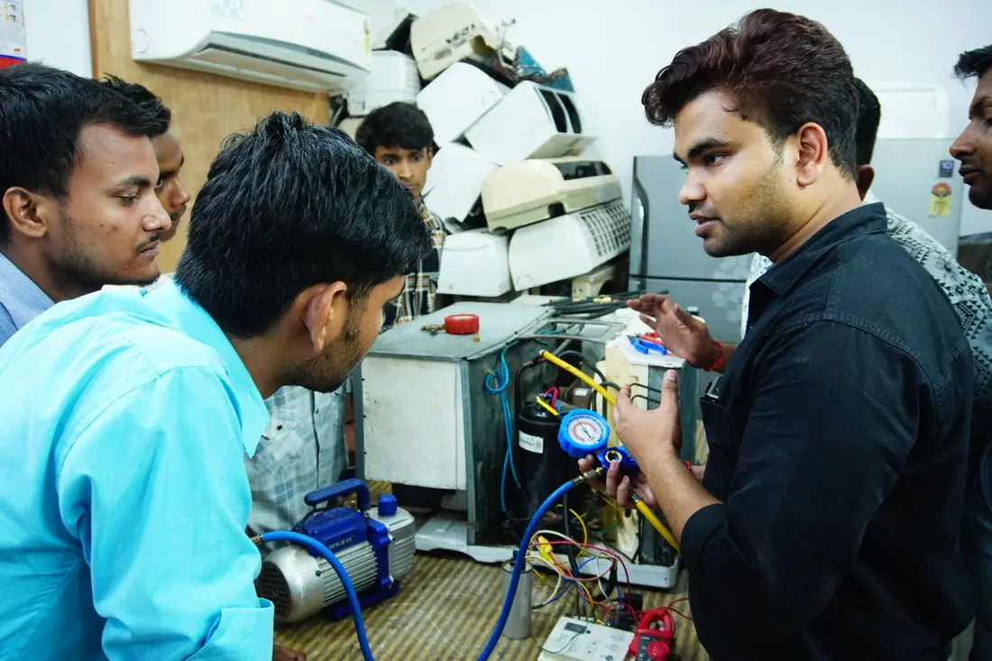 Technician at condenser