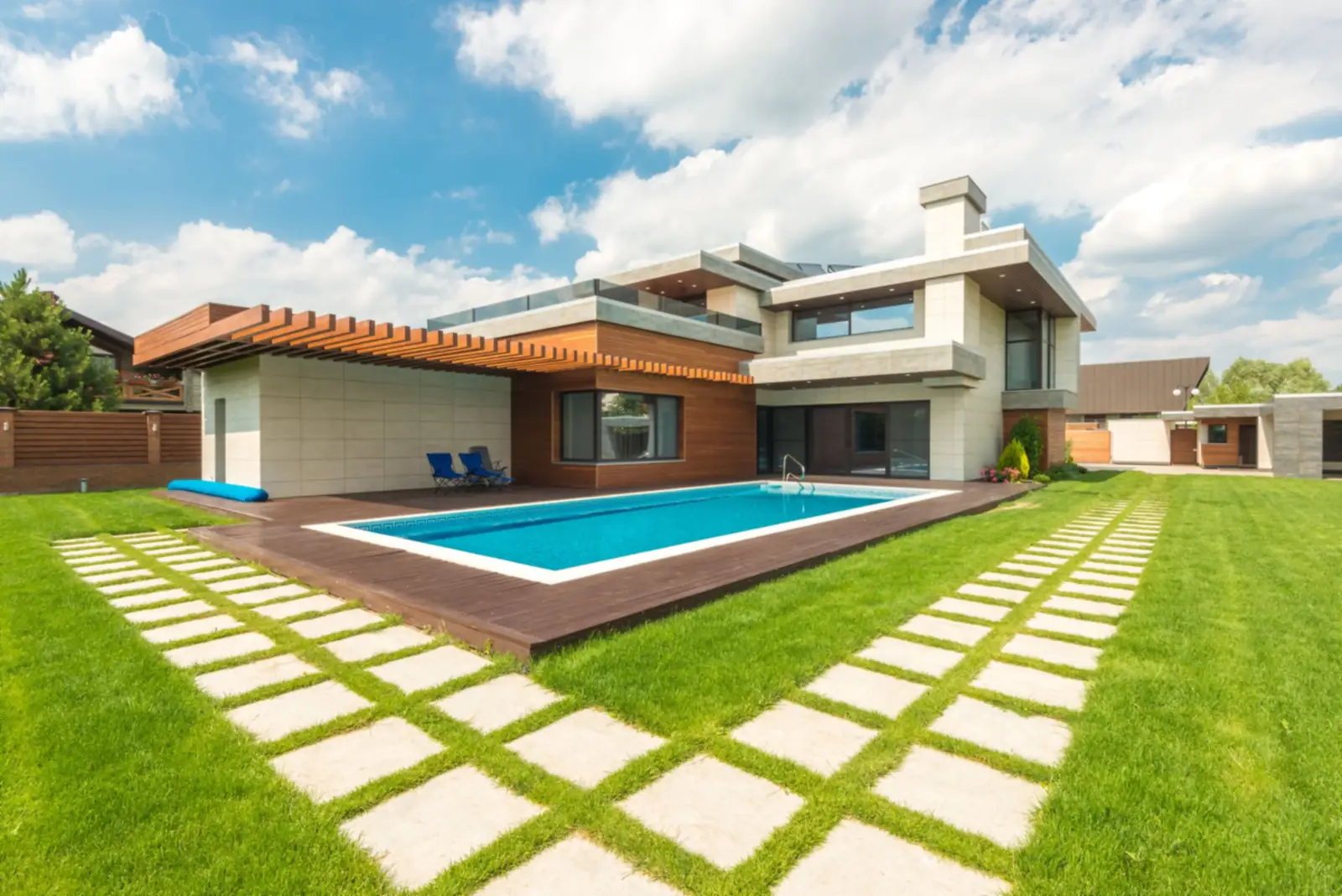 Modern home with lawn and stepping-stone path