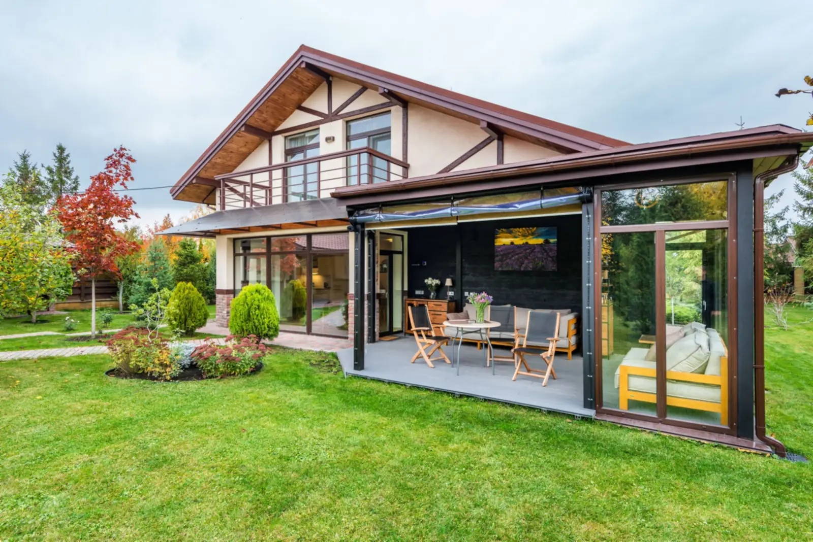 Home with a patio and green lawn