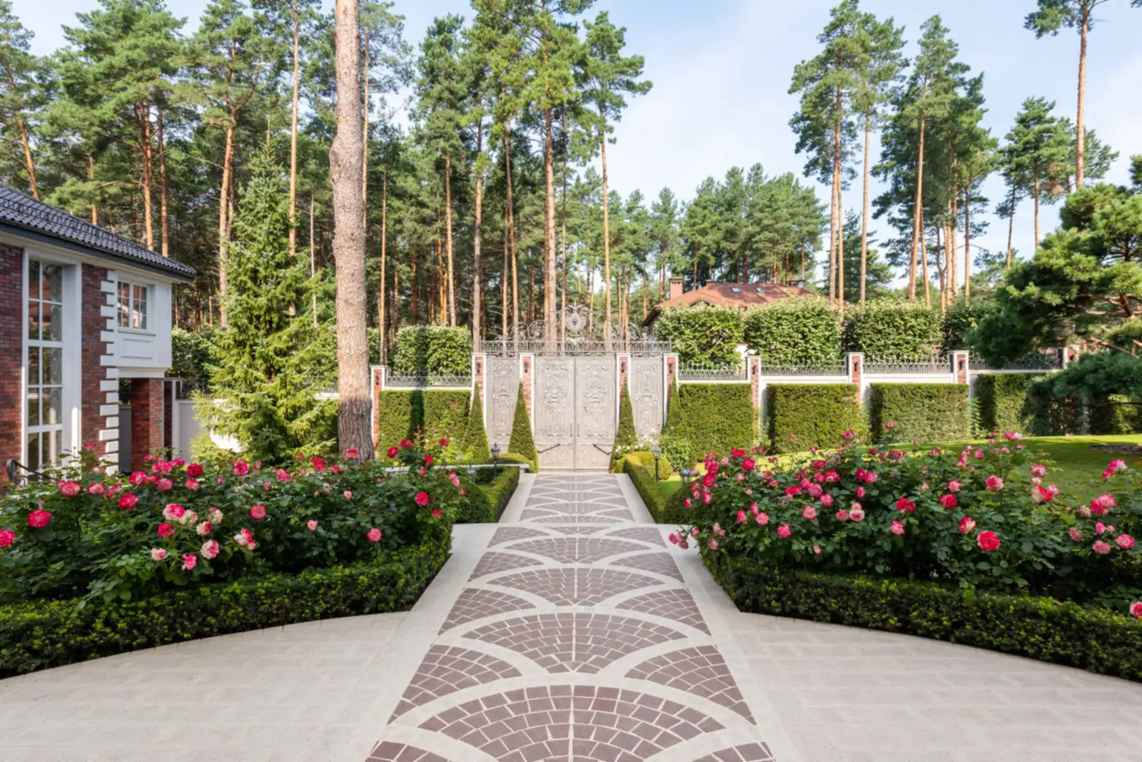 Formal garden path lined with roses