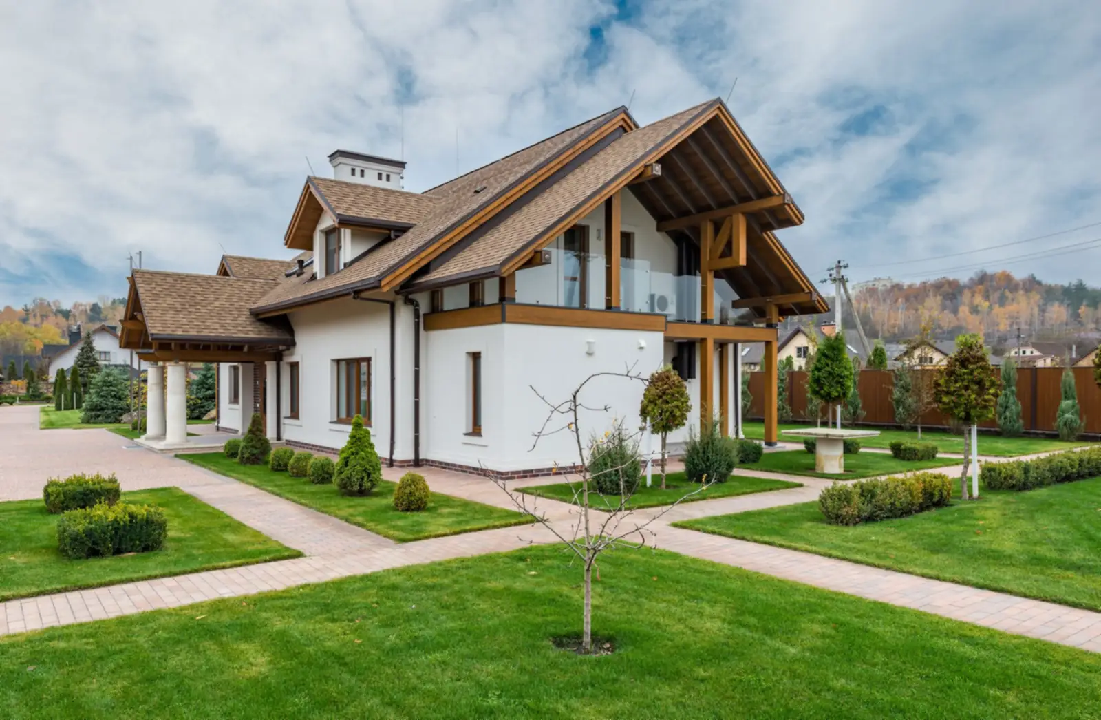 House with landscaped lawn and beds